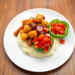Radish, Potato & Onion Medley on Mashed Potato with Tomato-Green Pepper Garnish