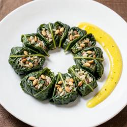 Stuffed Grape Leaves (Dolmades) with Lemony Tahini Sauce